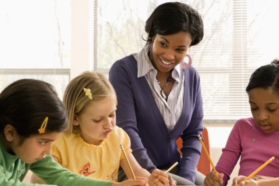 stock-photo-teacher-helping-students